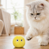 Interactive chirping cat toy ball in yellow, lifestyle image