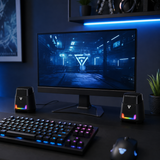 HELLSCREAM GS205 compact RGB gaming speakers on a modern blue-lit gaming desk
