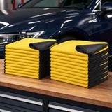 Twenty-pack of 30 by 60 cm yellow and charcoal microfiber car towels on a detailing bench