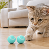 Two blue 150mAh automatic rolling cat toy balls with cat